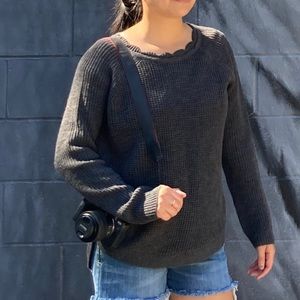 Grey sweater with scalloped neckline
